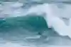 Kai Lenny surfing at the Nazare Big Wave Challenge