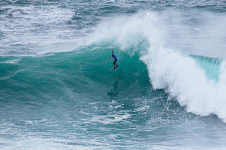 Kai Lenny surfing at the Nazare Big Wave Challenge