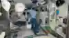 CIMON and ISS astronaut Alexander Gerst floating with a Rubik's Cube on the ISS.