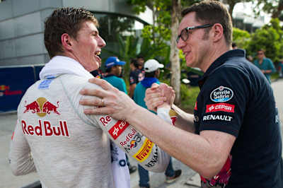 Dutch driver Max Verstappen talking with a Toro Rosso team member at the Malaysian F1 Grand Prix.