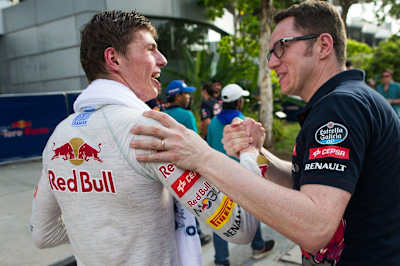 Dutch driver Max Verstappen talking with a Toro Rosso team member at the Malaysian F1 Grand Prix.