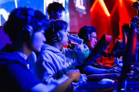 Team SchrodingerLee player energises with a Red Bull during the Red Bull One For All esports event at Fortress Melbourne, Australia, on June 7, 2025, under vibrant gaming lights