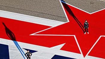 Alex Albon and Max Verstappen of Red Bull Racing pose for a photo on the track during previews ahead of the F1 Grand Prix of USA at Circuit of the Americas on October 31, 2019 in Austin, Texas.