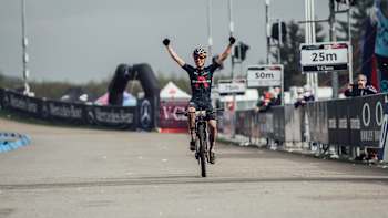 Tom Pidcock celebrates winning at the UCI XCO World Cup race in Nove Mesto, Czech Republic on May 16, 2021.