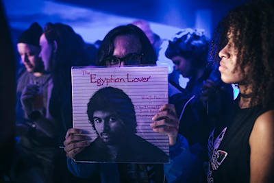 A fan shows off his sacred Egyptian Lover vinyl at the artist's #RBMASP gig in Sao Paulo, Brazil