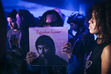 A fan shows off his sacred Egyptian Lover vinyl at the artist's #RBMASP gig in Sao Paulo, Brazil