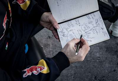 Dario Costa studies a diagram of his proposed flight down the Streif downhill ski course in Kitzbühel, Austria on January 18, 2025.