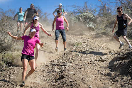 Competitors running downhill during Red Bull Defiance training.