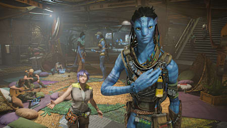 Screenshot aus Avatar: Frontiers of Pandora zeigt einen Na'vi und einen Menschen im Hauptquartier des Widerstandes.