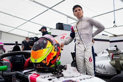 A portrait of the French driver Isack Hadjar.