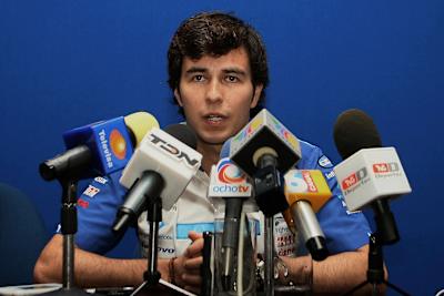 An image of Sergio ‘Checo’ Pérez answering questions at an F1 press conference.