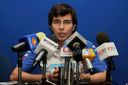 An image of Sergio ‘Checo’ Pérez answering questions at an F1 press conference.
