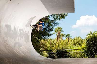 Sakura Kumeda scorpion tails a styled-out frontside crail in Japan