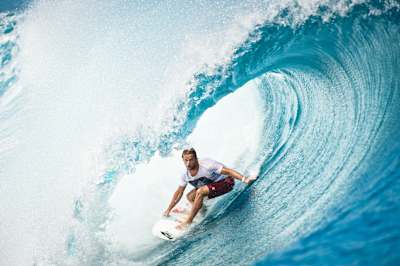 Dylan Longbottom surfing at Teahupo'o, Tahiti in a photograph shot by Michael Clark.
