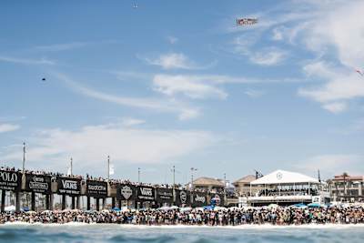 A packed beach watches the action at the US Open of Surfing in Huntington Beach, California, USA.