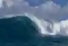 Professional big wave surfer Kai Lenny rides the barrel at Jaws on December 2, 2020.