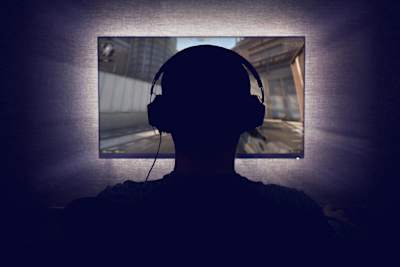 A PC gamer wearing a headset