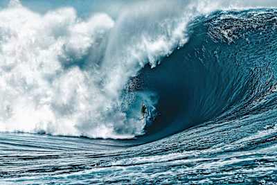 Nathan Fletcher rides an enormous wave during 2011's Code Red swell in Tahiti