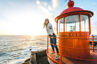 Justine Dupont at the most famous lighthouse in surfing in Nazaré, Portugal. 