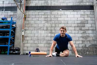 Rugby player Beauden Barrett performs the Pigeon Stretch 