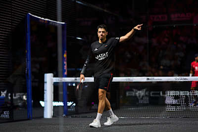 Agustin Tapia is captured in action on July 6, 2025 at the Bordeaux Premier Padel P2 finals in France, with Red Bull branding powering the energetic atmosphere