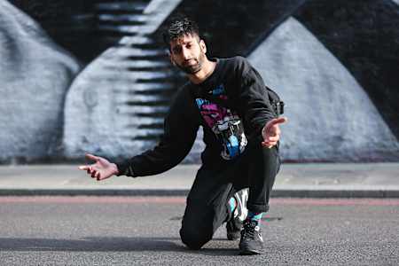 KhanFu does a kneeling pose.