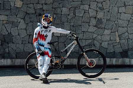 Loïc Bruni sits with his World Champs bike ready for the UCI Mountain Bike World Championships in Val di Sole, Italy.