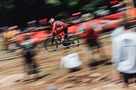 Loic Bruni racing at the 2022 men's DH World Cup finals race in Snowshoe.
