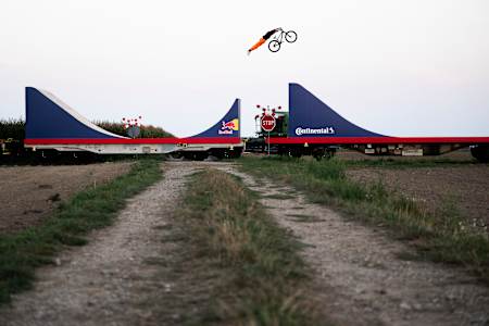 Dawid Godziek jumps the train cars on Red Bull Bike Express.