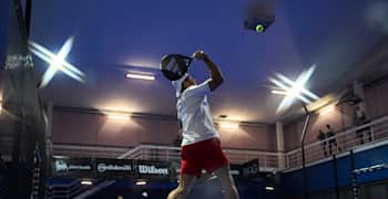 Over-the-net action from a Premier Padel tournament match in Milan, Italy.