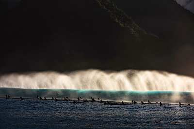 The morning breeze ripping the foam off the lip of the wave