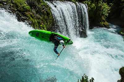 Ben Marr kayaks down a waterfall.