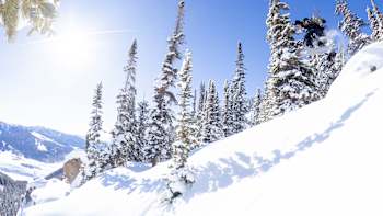 A snowboarder performing