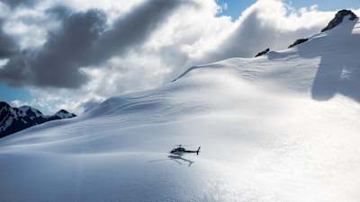 Enjoy panoramic views of the mountains during a helicopter ride