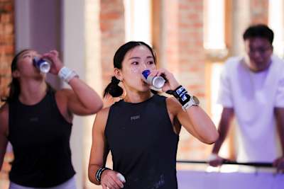 A participant drinking during the Red Bull Gym Clash event  