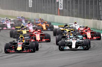 Max Verstappen leads Lewis Hamilton and the rest of the field into turn one at the start during the F1 GP of Mexico at Autodromo Hermanos Rodriguez.
