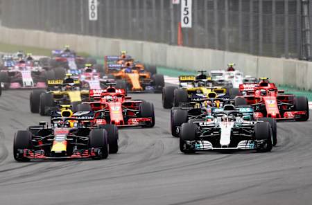 Max Verstappen leads Lewis Hamilton and the rest of the field into turn one at the start during the F1 GP of Mexico at Autodromo Hermanos Rodriguez.