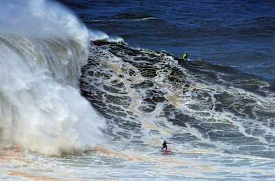 Justine Dupont surfes a big wave in Nazaré, Portugal on November 13, 2019.