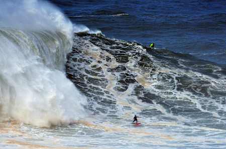 Justine Dupont surfes a big wave in Nazaré, Portugal on November 13, 2019.