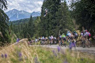 Tour de Pologne peloton passes through while Szymon Godziek backflips over them in Bukowina Tarzańska, Poland, on Aug. 4, 2017.