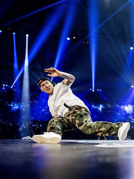 B-Boy Focus dancing on the floor at the big stage of Red Bull BC One.