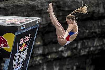 Eleanor Townsend Smart of the USA dives from the 21 metre platform during the first stop of the Red Bull Cliff Diving World Series at the Serpent`s Lair, Inis Mor, Ireland on June 24, 2017.