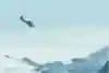 The soul flyers succeed in flying into the open door of an aircraft in mid-air, after BASE jumping off the summit of Jungfrau (4,158m) in the Alps, Lauterbach, Switzerland.