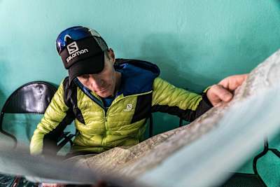 Ryno Griesel checks a map while crossing the Great Himalaya Trail.
