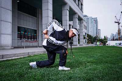 Angyil performs on grass outside of the venue
