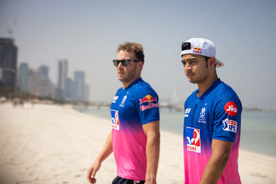 Riyan Parag and David Miller walk on a beach wearing the 2020 Rajasthan Royals jersey.