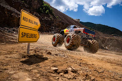 Max Verstappen passes a sign directing him to the Spielberg, the site of the Red Bull Ring F1 track.