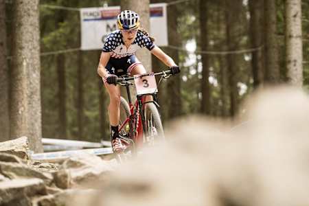 Kate Courtney rides during a UCI World Cup race