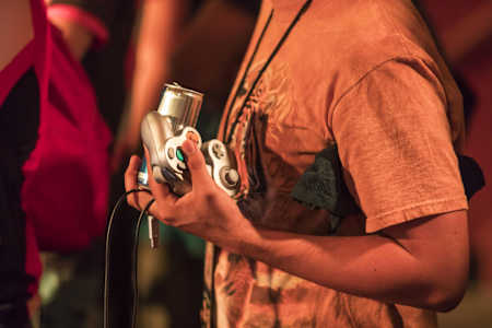 A fan holds his controller at Red Bull Smash: Gods and Gatekeepers, at the Wiltern Theater in Los Angeles, California, USA on 2 September, 2017.