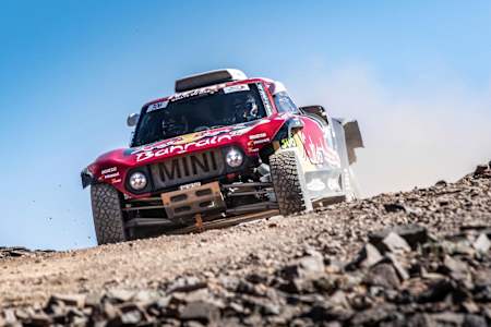 A photo of driver Carlos Sainz and Lucas Cruz in the X-Raid Mini JCW.